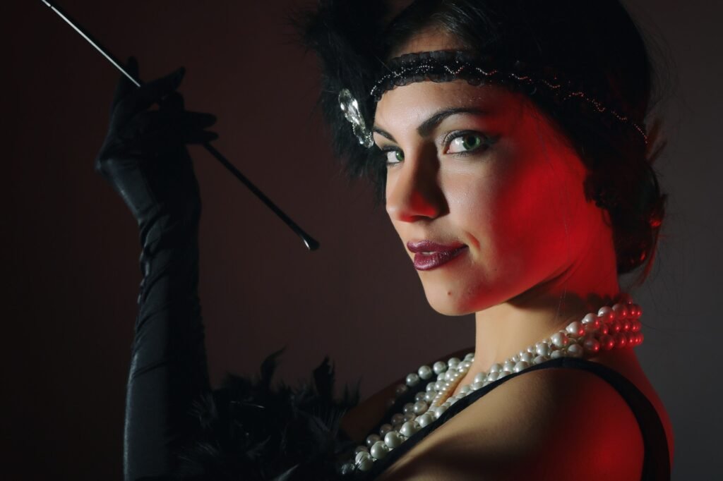 Beautiful flapper woman in gatsby epoch style. Old retro fashion. 1920, roaring twenties