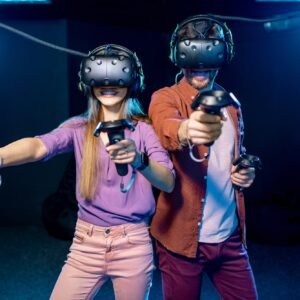 Man and woman playing game with virtual reality headset in the club